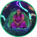 Photo of Maria Eugenia in a geode-looking chair.